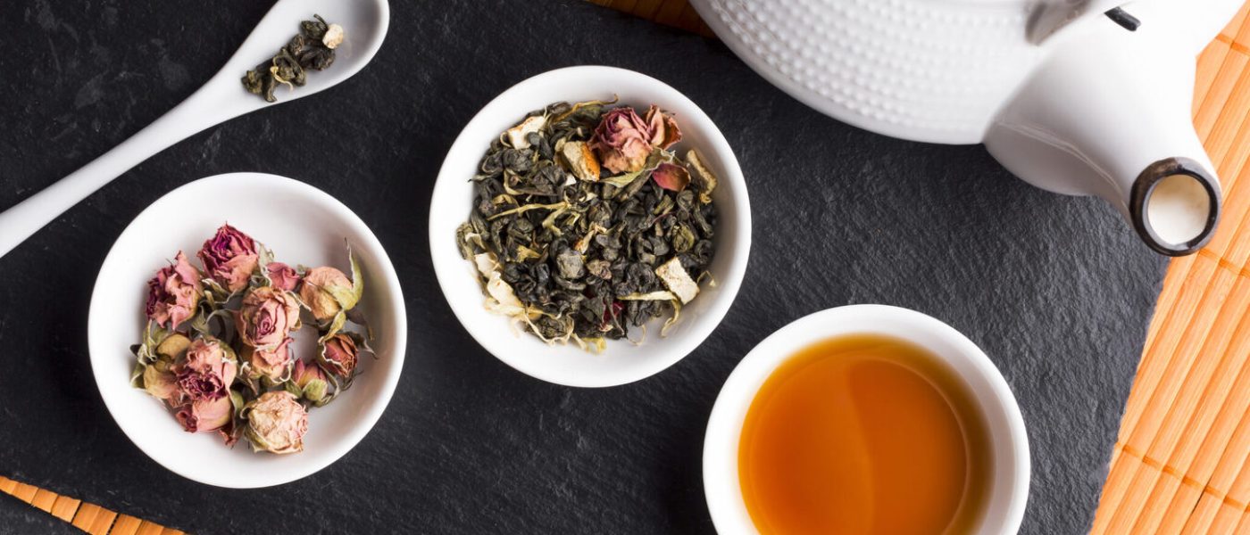 dry-roses-tea-herb-with-teapot-black-slate-placemat-2048x1365